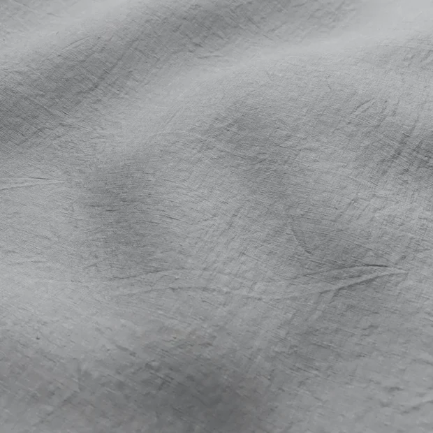 Photo of the fabric Satori Stonewash Dove Grey swatch by Mokum. Use for Curtains, Upholstery Light Duty, Accessory, Top of Bed. Style of Plain, Texture