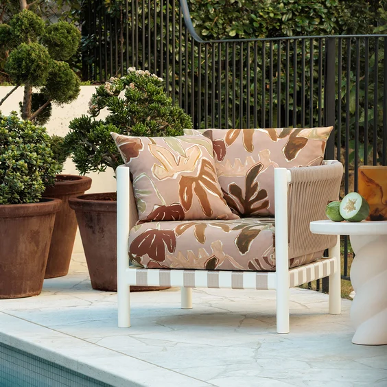 Biophilic patterned chair in poolside setting