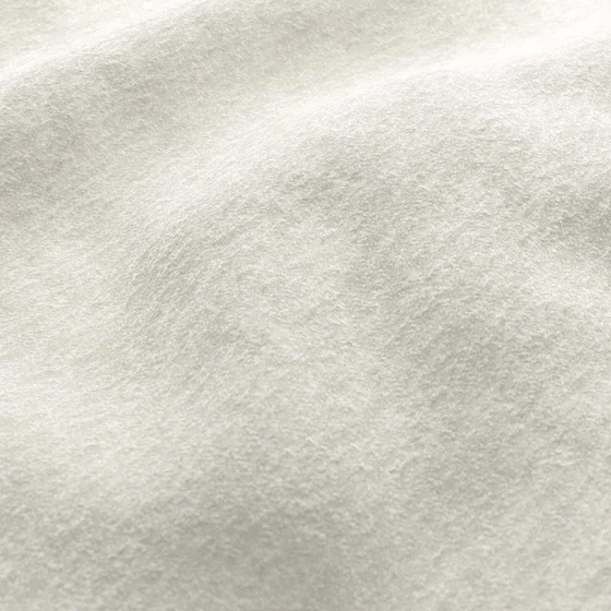 Photo of the fabric Snugly Pearl swatch by James Dunlop FibreGuard. Use for Upholstery, Accessory, Top of Bed. Style of Chenille, Plain