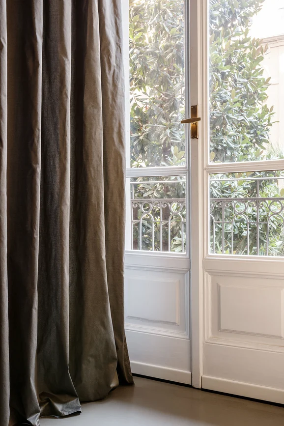 Photo of the fabric Aim 14555 537 in situ by Fischbacher 1819. Use for Curtains. Style of Plain