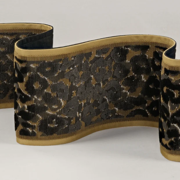 Photo of the fabric Leopard Velvet Braid T115 01 swatch by Romo. Use for Trim