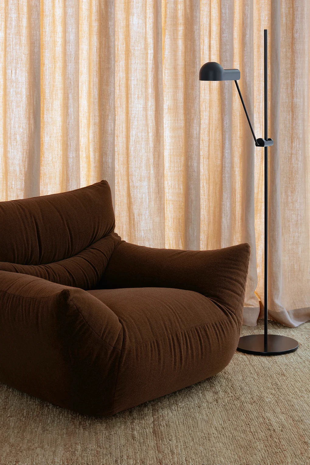 Upholstered brown velvet chair in modern interior setting