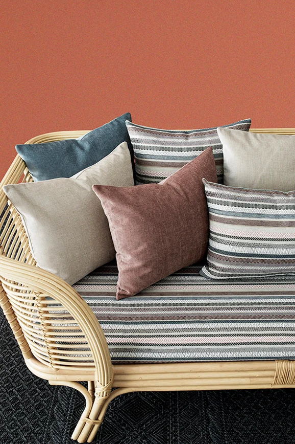 Photo of the fabric Nixon Spice in situ by James Dunlop. Use for Upholstery, Accessory. Style of Stripe