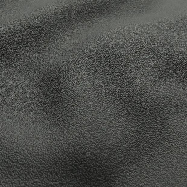 Photo of the fabric Snowdown Charcoal swatch by Zepel FibreGuard. Use for Curtains, Upholstery, Accessory, Top of Bed. Style of Plain, Texture