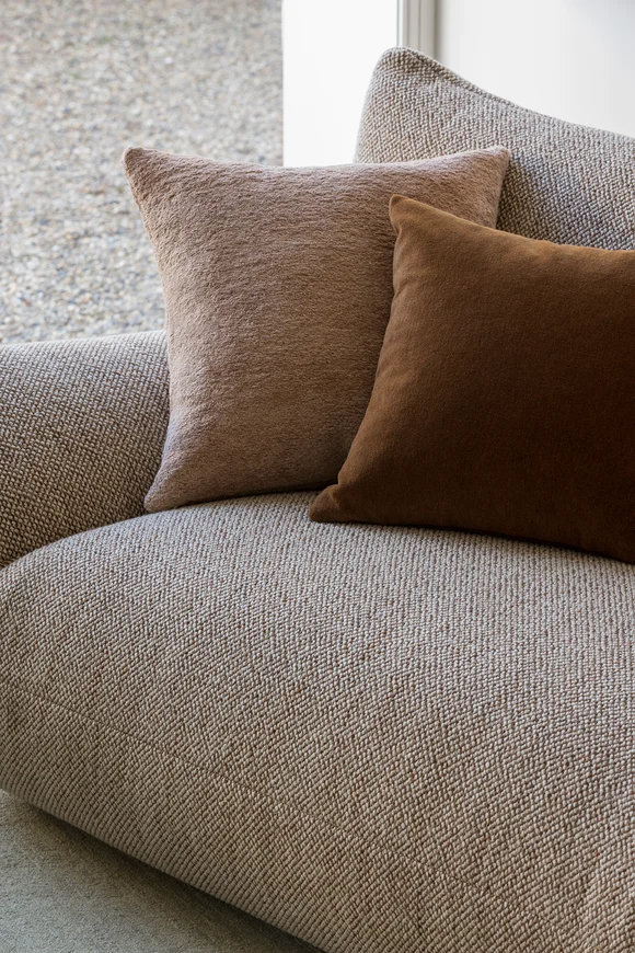 Sofa in Vomo colour Lava, cushions in Modernist colour Blush and Lama Velvet colour Chestnut, all by Mokum
