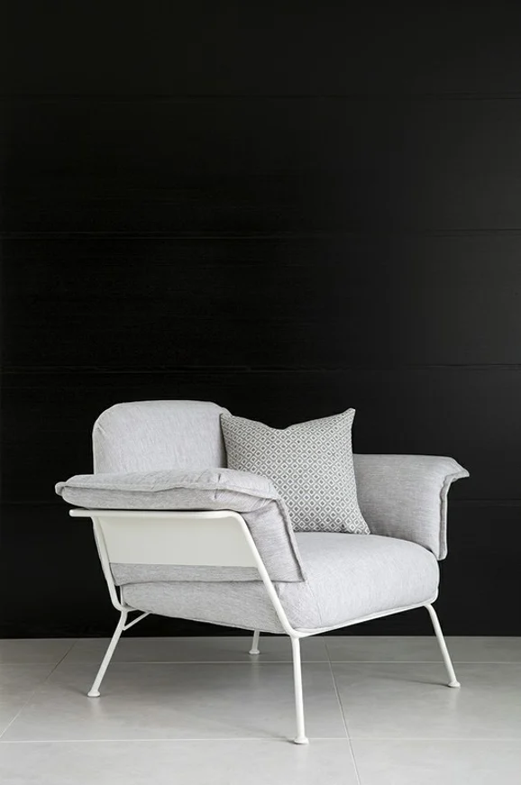 Photo of the fabric Newport Carbon in situ by James Dunlop. Use for Upholstery, Accessory. Style of Plain