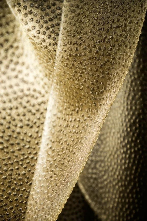 Photo of the fabric Aurum 14407 705 in situ by Fischbacher 1819. Use for Sheer Curtains. Style of Sheer