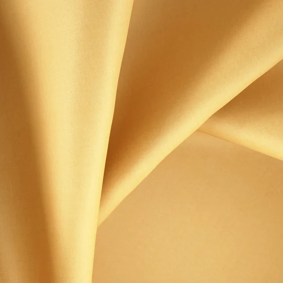 Photo of the fabric Catwalk Cashew swatch by Zepel. Use for Curtains, Upholstery Light Duty, Accessory, Top of Bed. Style of Plain, Taffeta