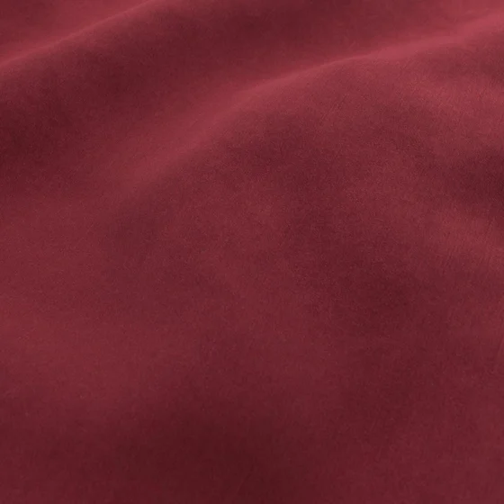Photo of the fabric Lumen Cabernet swatch by FR-One. Use for Curtains, Upholstery, Accessory, Top of Bed. Style of Plain, Velvet