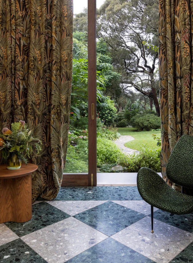 Curtains in Jungle Room colour Antique and chair in Leopardo colour Palm Leaf both by Catherine Martin by Mokum