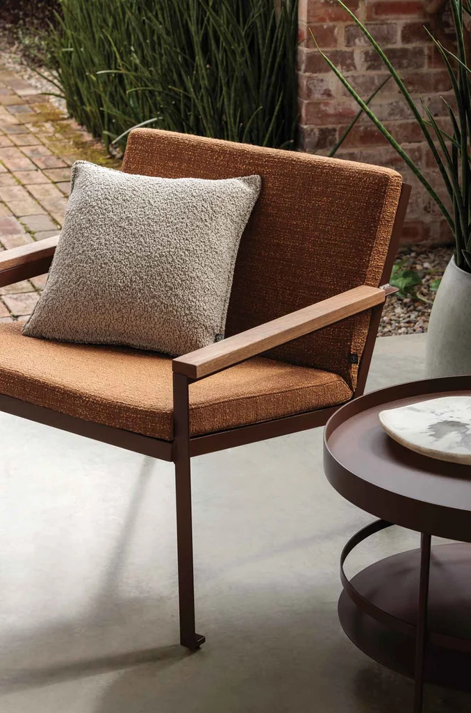 Chair in Elba colour Terracotta, cushion in Sole Boucl&eacute;&nbsp;colour Seasalt both by Mokum