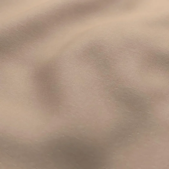 Photo of the fabric Satori Stonewash Nude swatch by Mokum. Use for Curtains, Upholstery Light Duty, Accessory, Top of Bed. Style of Plain, Texture