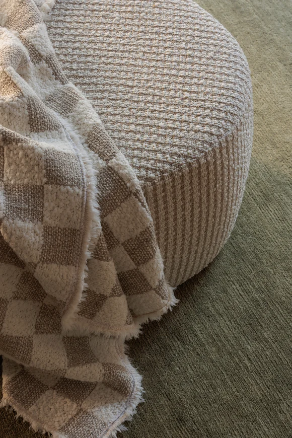 Throw in Muratura, ottoman in Quadro Boucle both by Mokum