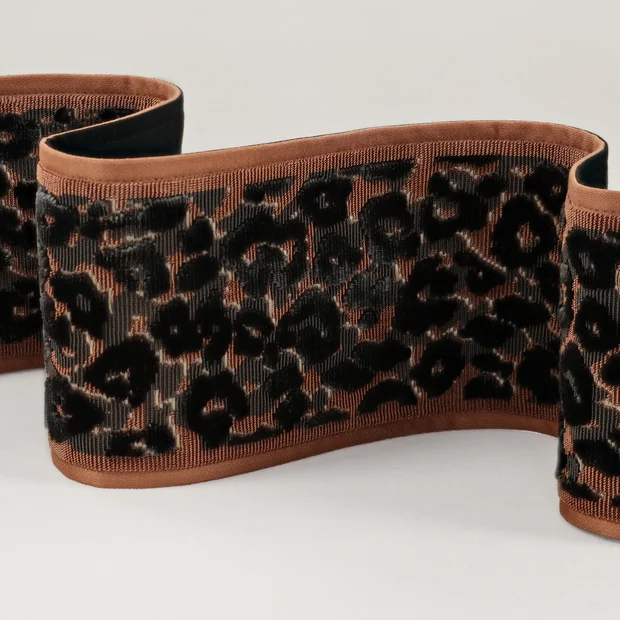 Photo of the fabric Leopard Velvet Braid T115 06 swatch by Romo. Use for Trim