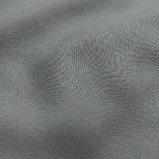 Photo of the fabric Infinite Celadon swatch by Mokum. Use for Curtains, Upholstery, Accessory, Top of Bed. Style of Plain, Texture