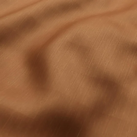 Photo of the fabric Silky Nutmeg swatch by Zepel. Use for Curtains, Accessory, Top of Bed. Style of Plain, Texture