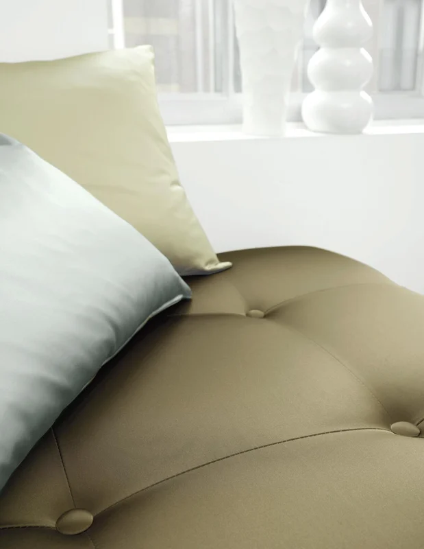 Photo of the fabric Sateen 137 Pewter in situ by Zepel. Use for Curtains, Upholstery, Accessory, Top of Bed. Style of Plain, Taffeta