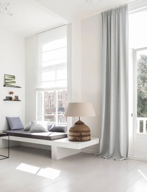 Photo of the fabric Zia Zinc in situ by James Dunlop. Use for Curtains, Upholstery, Accessory, Top of Bed. Style of Plain, Texture
