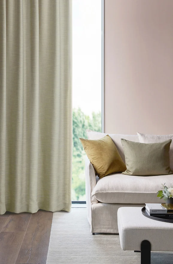 Photo of the fabric Maharaja II Tussah in situ by James Dunlop Essentials. Use for Curtains, Upholstery Light Duty, Accessory, Top of Bed. Style of Plain, Texture