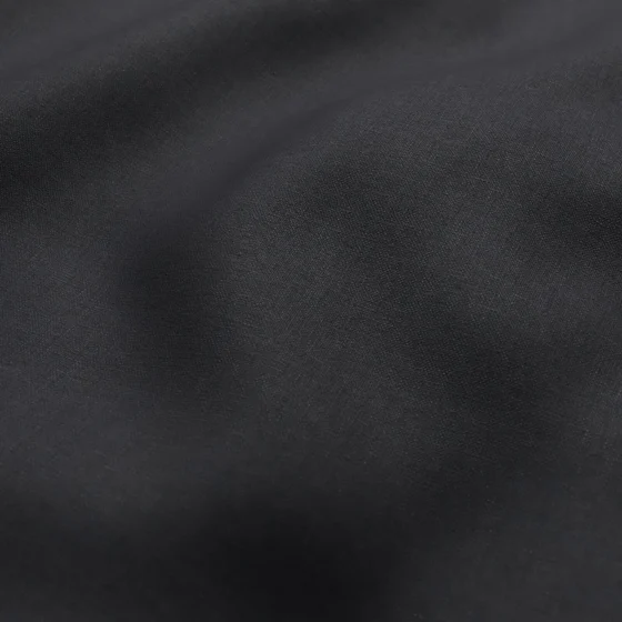 Photo of the fabric Kanvas Ebony swatch by Zepel FibreGuard. Use for Curtains, Upholstery, Accessory, Top of Bed. Style of Plain, Taffeta
