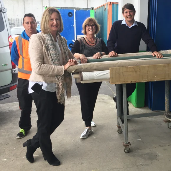 From left: Jason and Sue from James Dunlop Textiles, Janene from Guthrie Bowron and Conrad from Habitat for Humanity with just a few of the rolls.