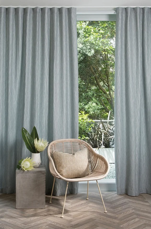 Photo of the fabric Sandrift Silver in situ by James Dunlop Essentials. Use for Curtains, Accessory. Style of Plain, Texture