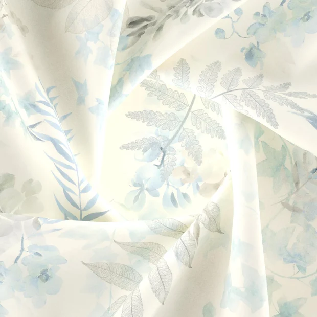 Photo of the fabric Plumeria Azure swatch by Zepel. Use for Curtains, Upholstery, Accessory, Top of Bed. Style of Floral And Botannical, Print