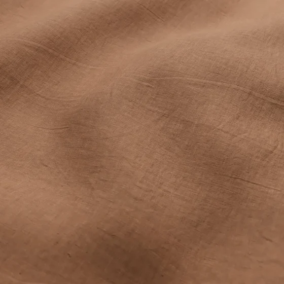 Photo of the fabric Satori Stonewash Burnt Orange swatch by Mokum. Use for Curtains, Upholstery Light Duty, Accessory, Top of Bed. Style of Plain, Texture
