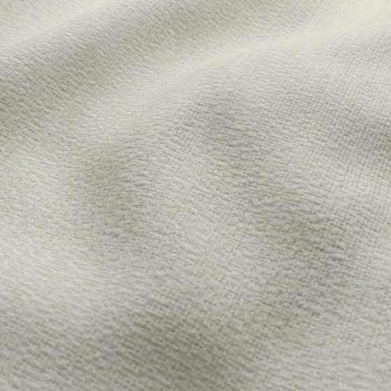 Photo of the fabric Stretch Ivory swatch by James Dunlop FibreGuard. Use for Upholstery, Accessory. Style of Plain, Texture