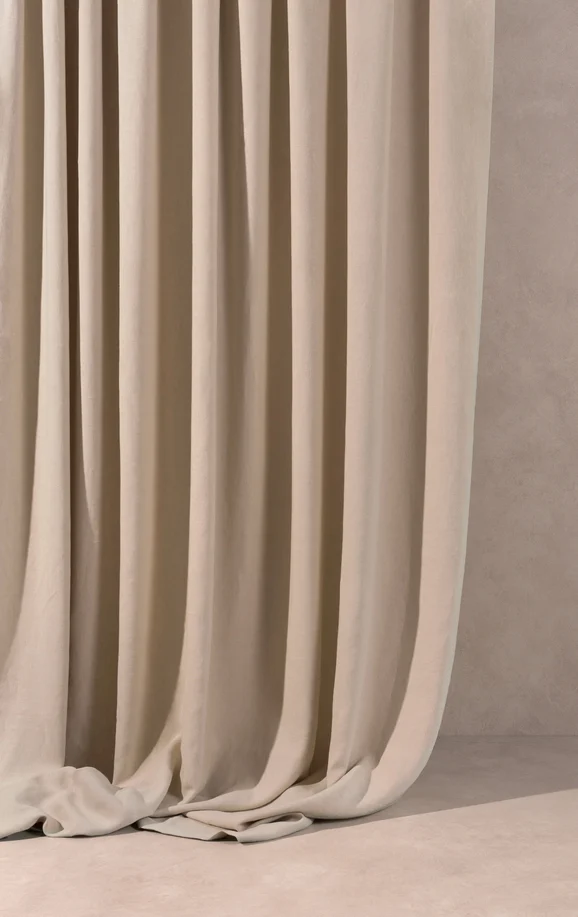 Photo of the fabric Obi Stonewash Sage in situ by Mokum. Use for Curtains, Upholstery Light Duty, Accessory, Top of Bed. Style of Plain, Texture