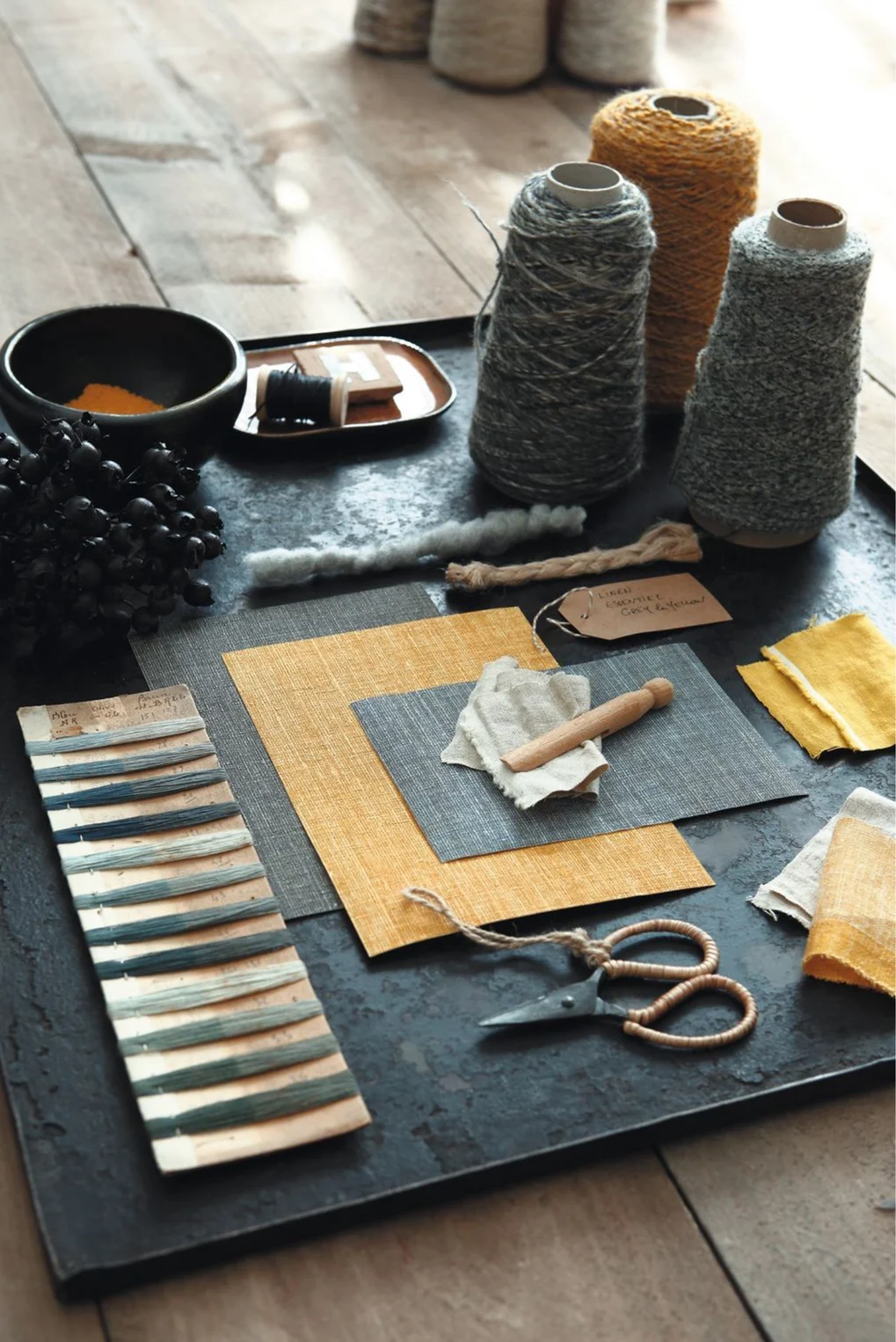 Blue and mustard coloured textile mood board