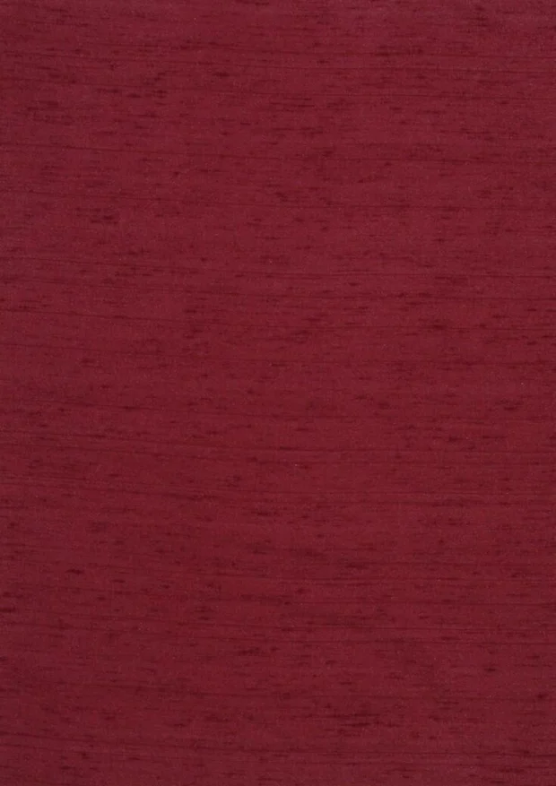 Photo of the fabric Luxe Burgundy swatch by James Dunlop Essentials. Use for Curtains, Accessory, Top of Bed. Style of Plain, Texture