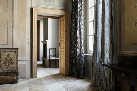 Photo of the fabric Luminate 14549 907 in situ by Fischbacher 1819. Use for Curtains. Style of Plain, Texture