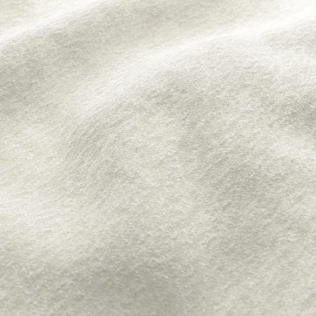 Photo of the fabric Snugly Pearl swatch by James Dunlop FibreGuard. Use for Upholstery, Accessory, Top of Bed. Style of Chenille, Plain