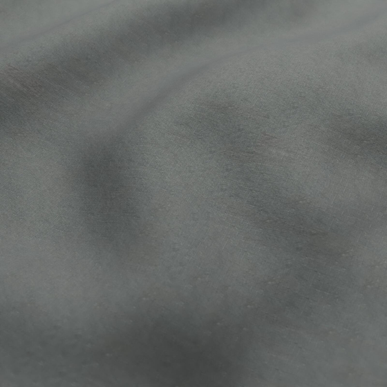 Photo of the fabric Satori Stonewash Slate swatch by Mokum. Use for Curtains, Upholstery Light Duty, Accessory, Top of Bed. Style of Plain, Texture