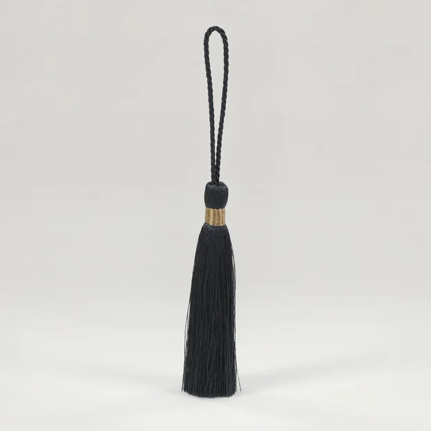 Photo of the fabric Key Tassel T121 02 swatch by Romo. Use for Trim