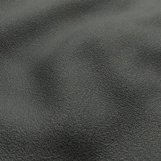 Photo of the fabric Snowdown Charcoal swatch by Zepel FibreGuard. Use for Curtains, Upholstery, Accessory, Top of Bed. Style of Plain, Texture