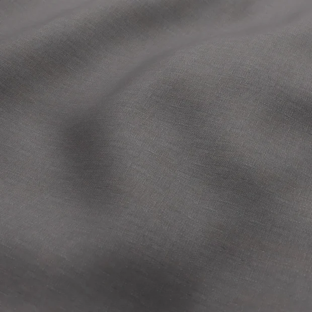 Photo of the fabric Infinite Night Shade swatch by Mokum. Use for Curtains, Upholstery, Accessory, Top of Bed. Style of Plain, Texture