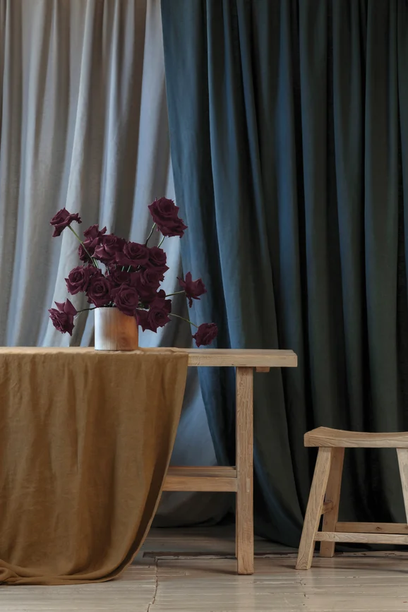 Photo of the fabric Satori Stonewash Chalk in situ by Mokum. Use for Curtains, Upholstery Light Duty, Accessory, Top of Bed. Style of Plain, Texture