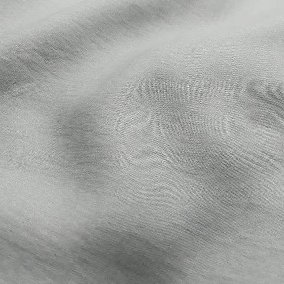Photo of the fabric Infinite Silver swatch by Mokum. Use for Curtains, Upholstery, Accessory, Top of Bed. Style of Plain, Texture