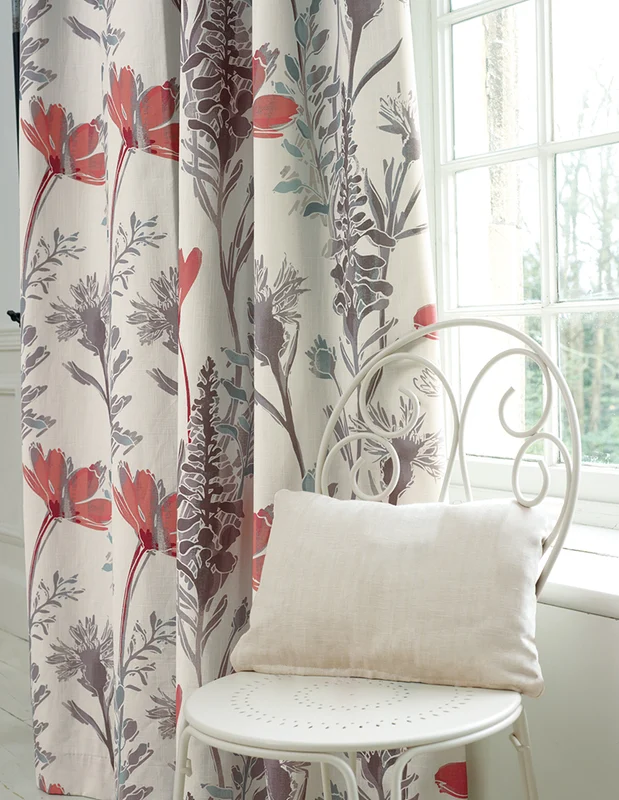 Photo of the fabric Bloom Saffron in situ by James Dunlop. Use for Curtains, Upholstery Light Duty, Accessory, Top of Bed. Style of Floral And Botannical, Print