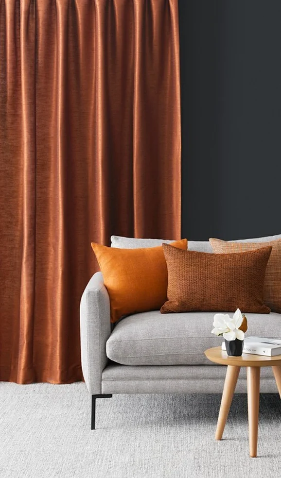 Photo of the fabric Silk Road Pumpkin in situ by James Dunlop Essentials. Use for Curtains, Accessory. Style of Plain, Texture