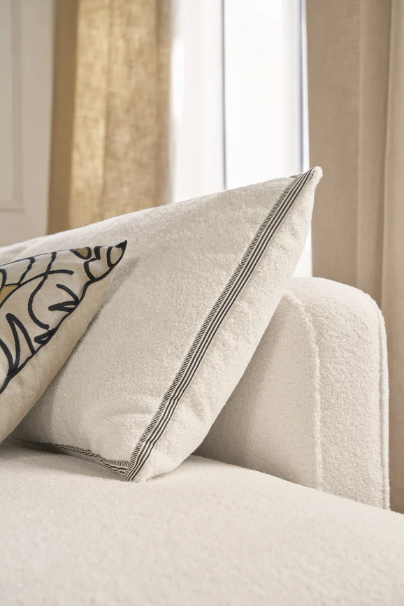 Photo of the fabric Nepal 8999 8999 0951 in situ by Casamance. Use for Upholstery, Accessory, Top of Bed. Style of Plain, Texture