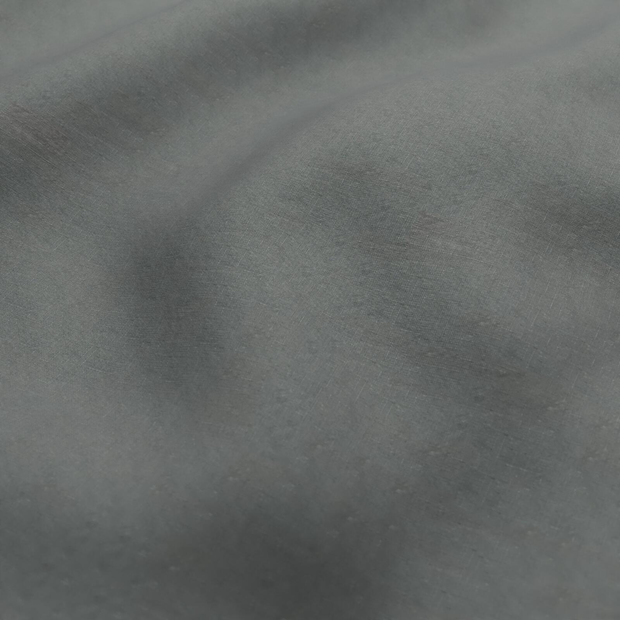 Photo of the fabric Satori Stonewash Slate swatch by Mokum. Use for Curtains, Upholstery Light Duty, Accessory, Top of Bed. Style of Plain, Texture