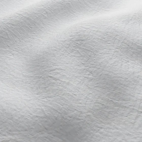 Photo of the fabric Satori Stonewash Whitewash swatch by Mokum. Use for Curtains, Upholstery Light Duty, Accessory, Top of Bed. Style of Plain, Texture