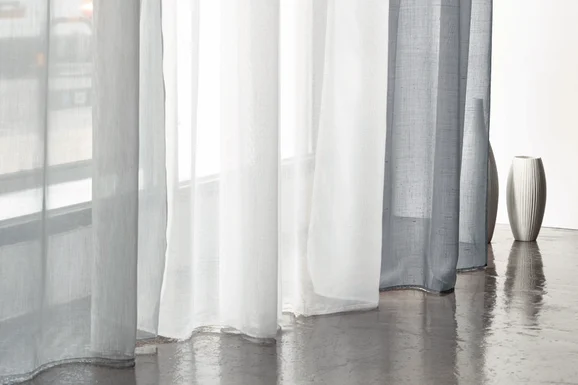 Photo of the fabric Bergen FR V1161 18 in situ by Villa Nova. Use for Curtains. Style of Plain