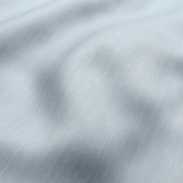 Photo of the fabric Luxe Sky swatch by James Dunlop Essentials. Use for Curtains, Accessory, Top of Bed. Style of Plain, Texture