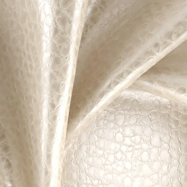 Photo of the fabric Textura Metallic Pearl swatch by Zepel. Use for Upholstery. Style of Animals And Birds, Leather And Vinyl
