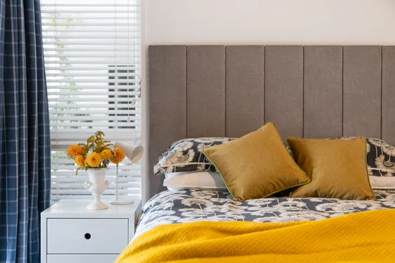 Juniper, flat top Bedhead in Deluxe, Feather.
Cushions in Deluxe, Amber and Deluxe in Lime.