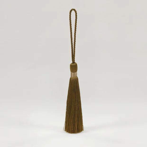 Photo of the fabric Key Tassel T121 04 swatch by Romo. Use for Trim
